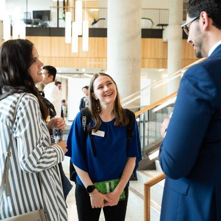 MBA students talking in Rowling Hall