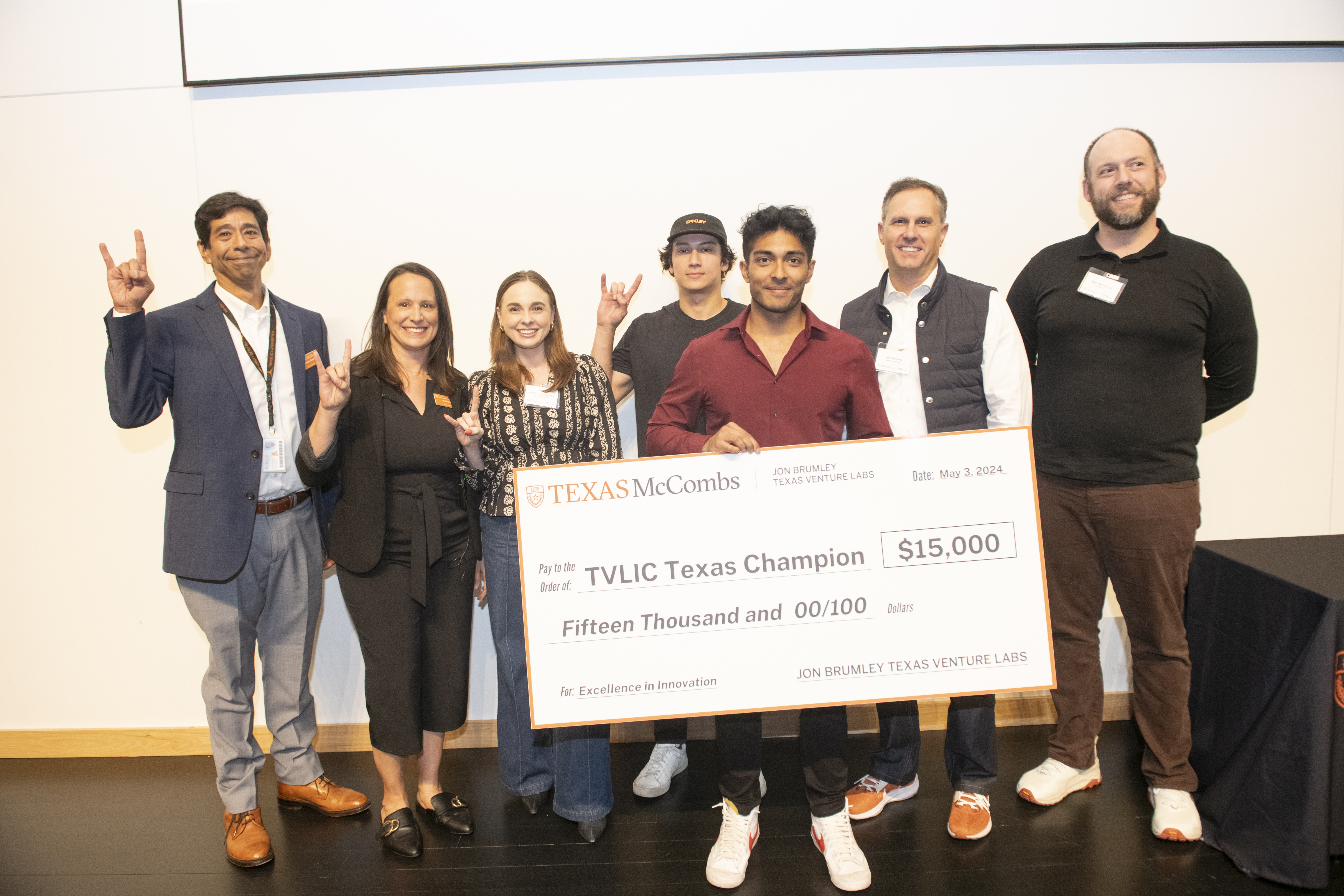 NovaBuild founder Anuj Swaminathan holds the big check after winning the Spring 2024 Texas Venture Labs Investment Competition.