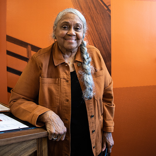 McCombs alumna Peggy Holland smiles at her lounge dedication ceremony