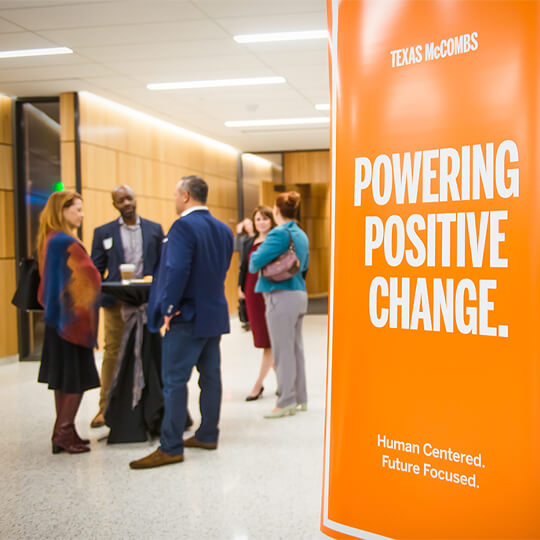 Powering Positive Change sign at alumni event