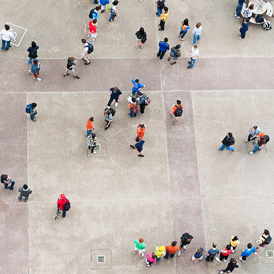 Overhead view of students walking on sidewalk