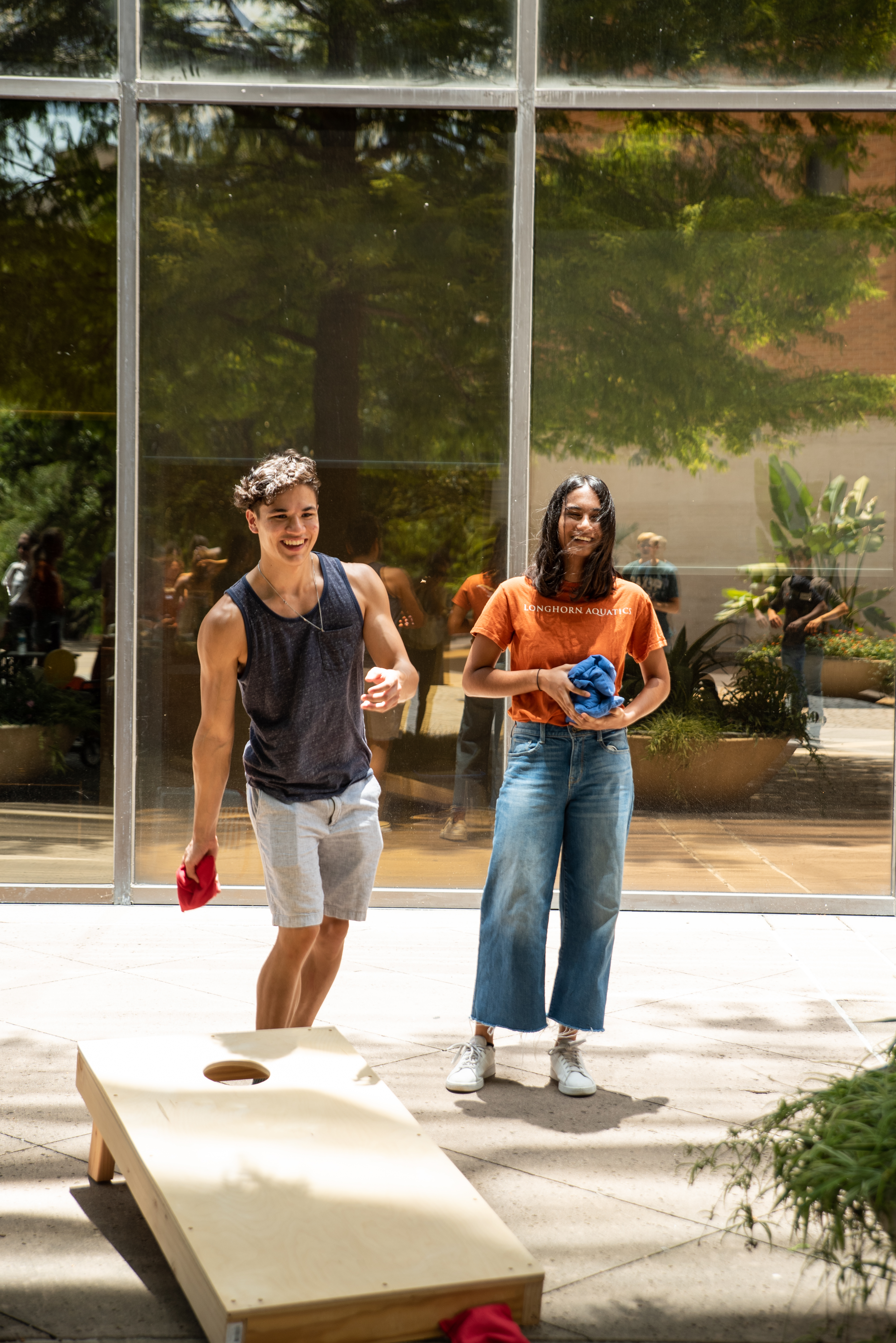 students playing cornhole