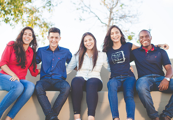 Students Sitting on Wall