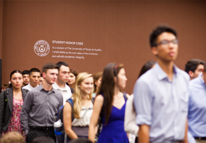 Standing students with Honor Code in background