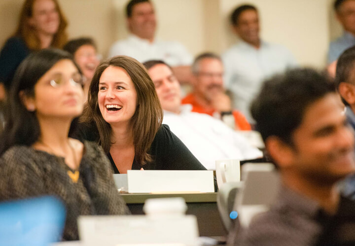 Person laughs in lecture hall