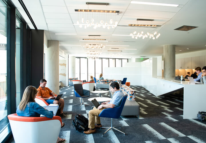 Students working in Rowling Hall sitting area