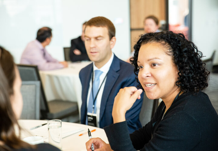 Two panel attendees speak together