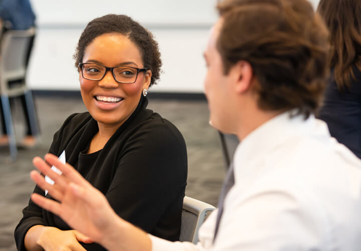 Two South by Southwest attendees talk together