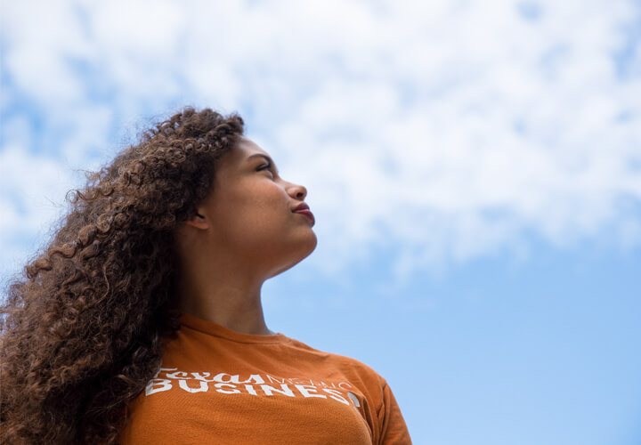 McCombs student looks toward sky