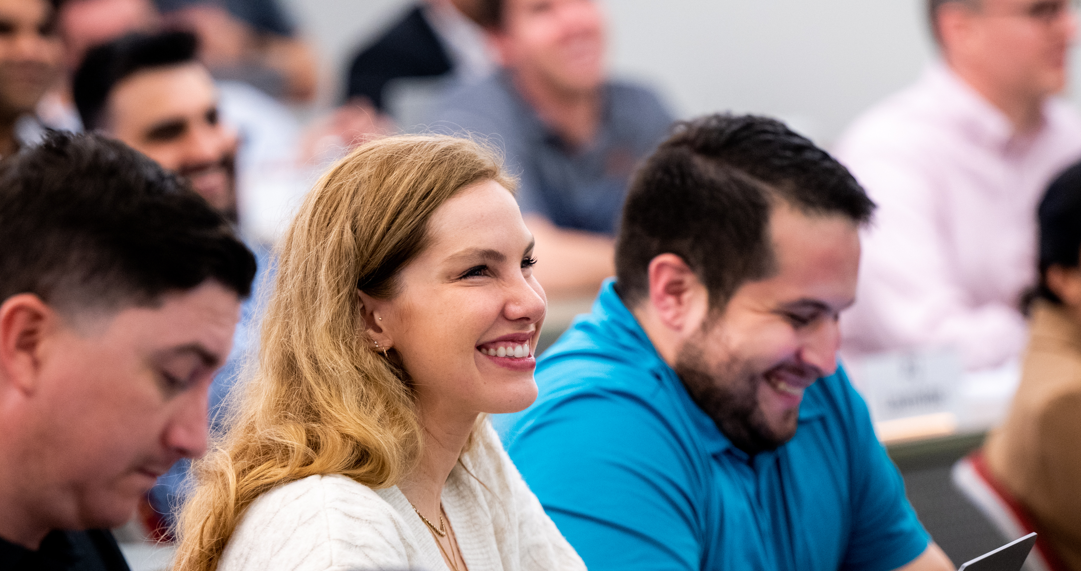 two students smiling in a classroom