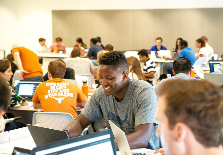 Students on laptops in classroom