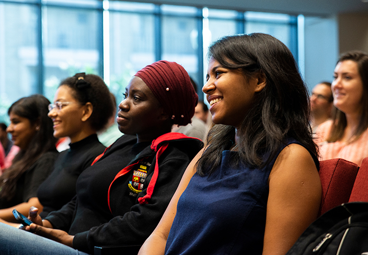 Students listen attentively at MBA Welcome event