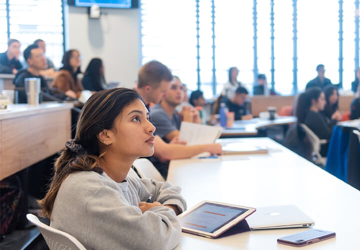 MS Program student listens in class