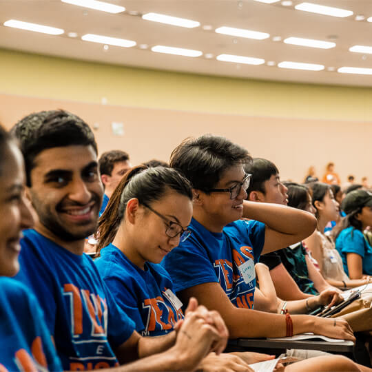 Students sit in lecture hall at Gone to Texas event