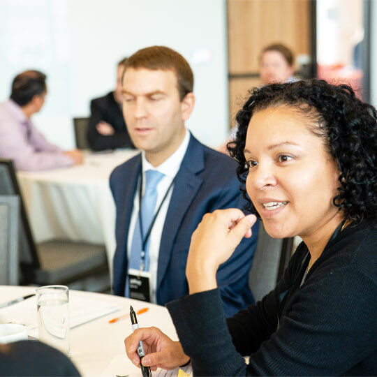 Two panel attendees speak together