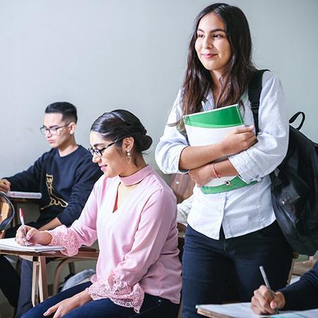 Student Standing in Classroom