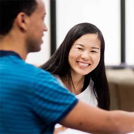 Two smiling MBA students