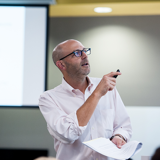 professor teaching in classroom