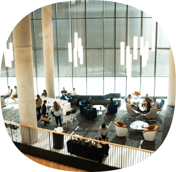 Aerial view of an open space with couches in an acedemic building.