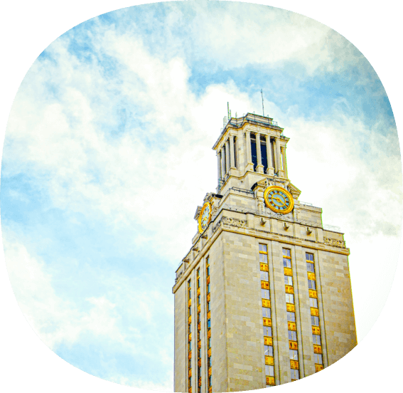 Tall tower building at the Univeristy of Texas with a blue sky and clouds.